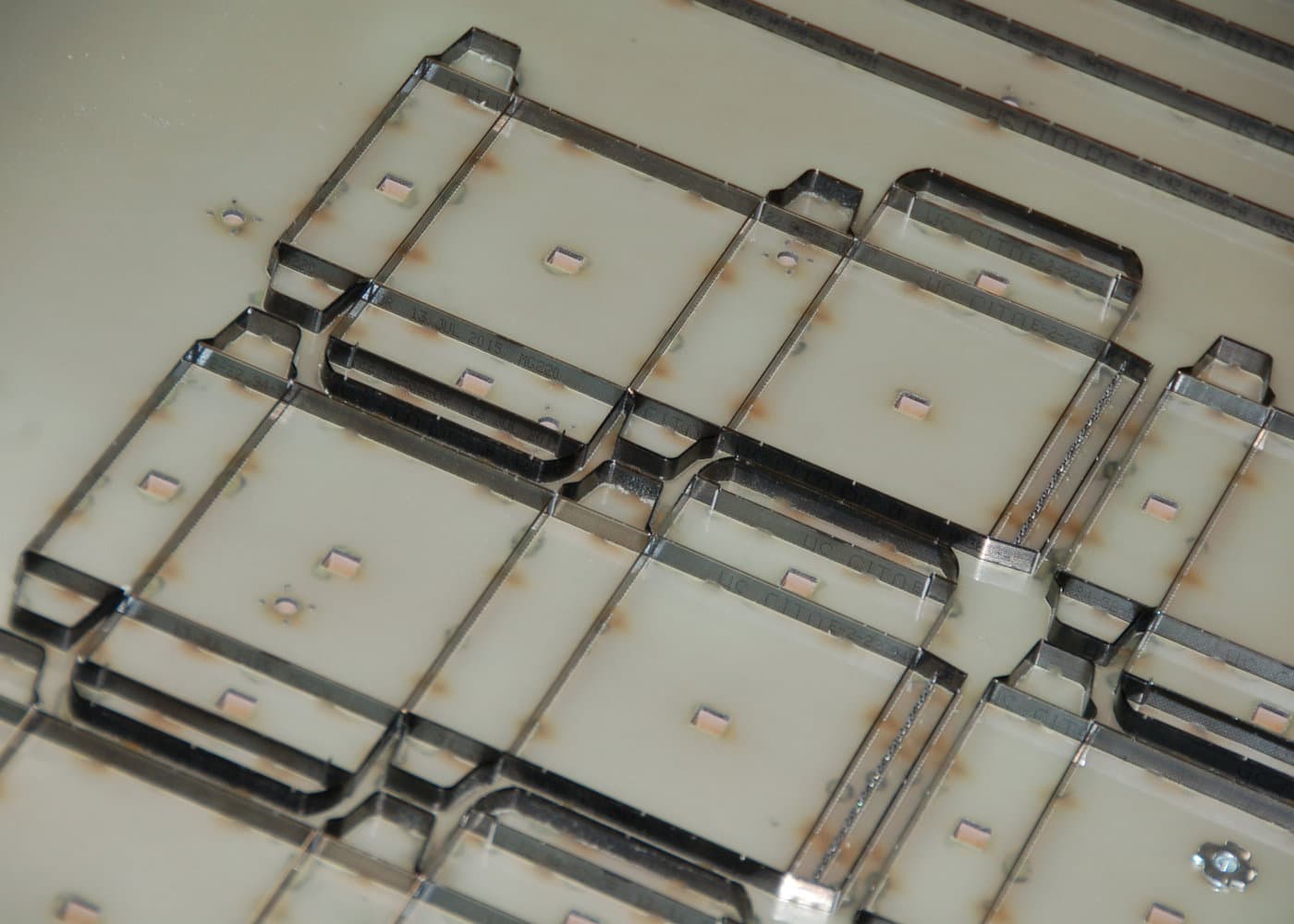 Steel rule set into a die board in a tight carton nest